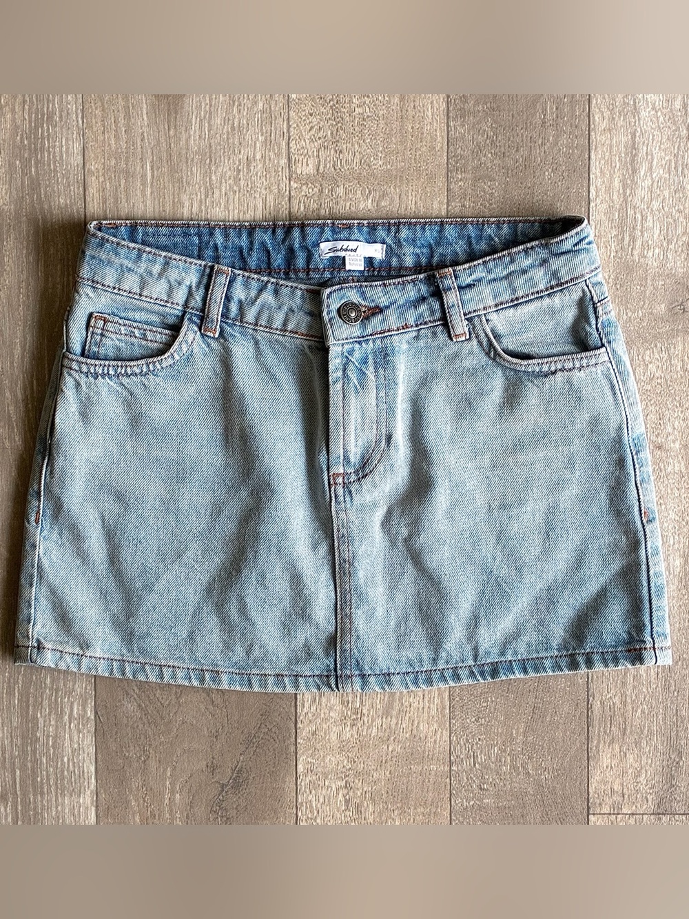 Subdued Light Wash Denim Mini skirt
Size: XS